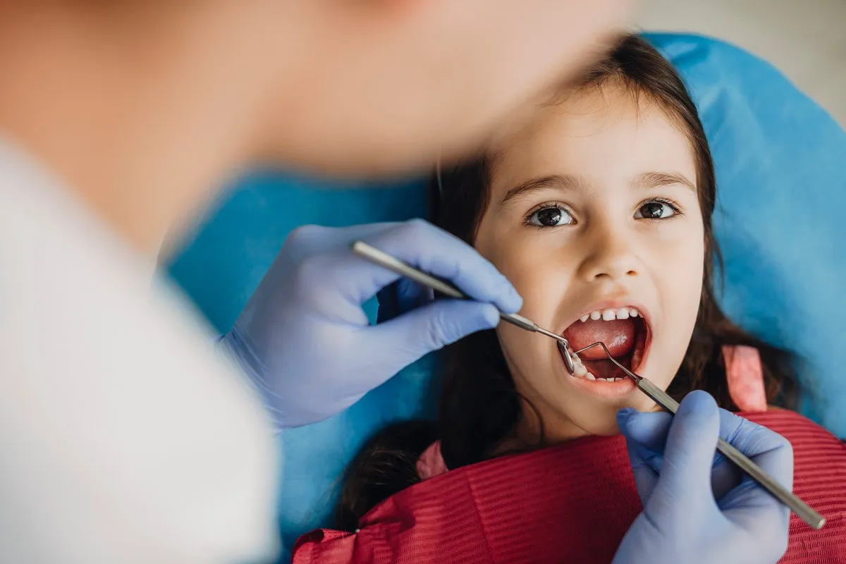 Child smiling during first orthodontic visit consultation