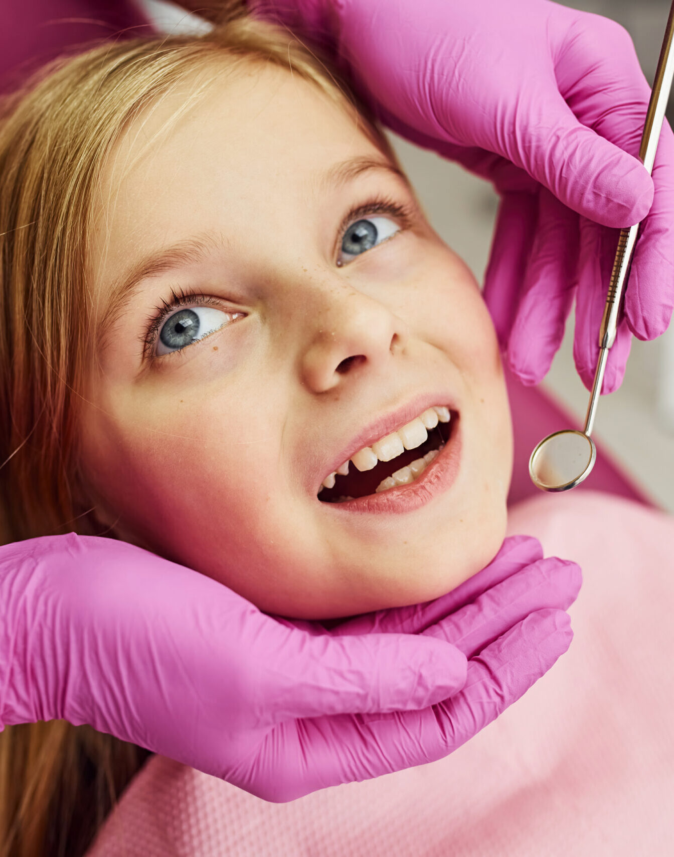 Little girl visiting dentist in clinic. Conception of stomatology.